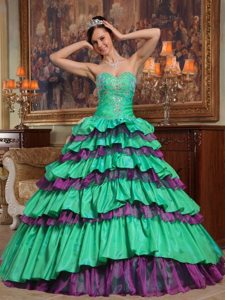 Appliqued Green and Purple Quinceanera Dress with Ruffled Layers